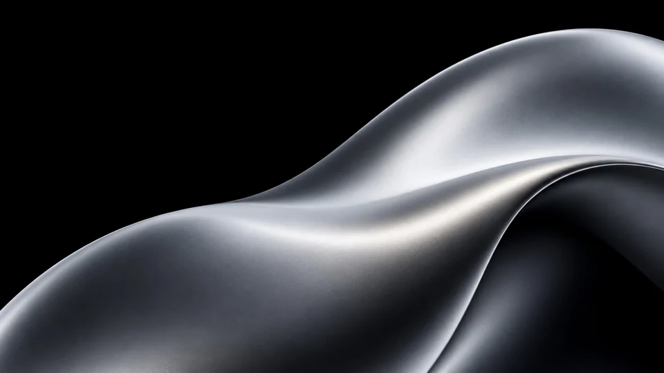 A broad sculptural fold in soft satin aluminium